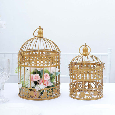 Gold decorative birdcages with flowers inside, perfect for home decor.