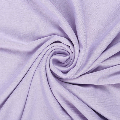 Light purple fabric in a spiral fold, showcasing texture and color.
