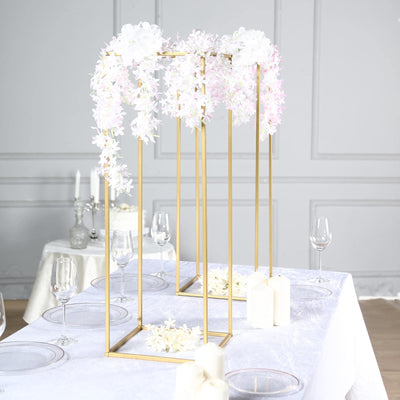 Elegant floral centerpiece with gold frame for wedding decor.