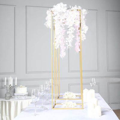 Elegant floral centerpiece with gold frame for weddings or events.