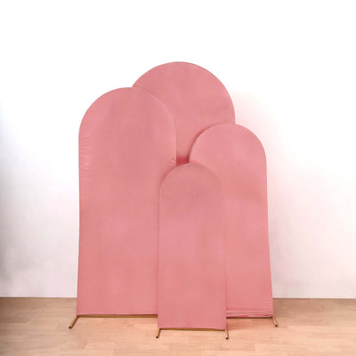 Set of four pink arch-shaped backdrops in varying sizes.