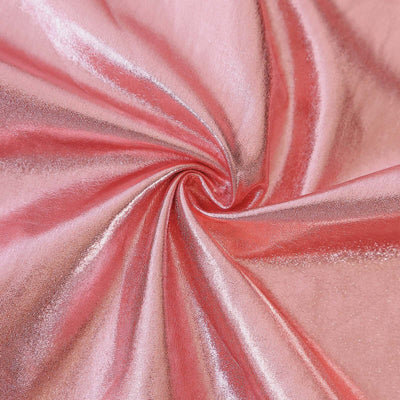 Shimmering pink fabric with a smooth, swirling texture.