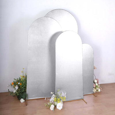Silver photo reflectors in various sizes with floral accents on a studio backdrop.