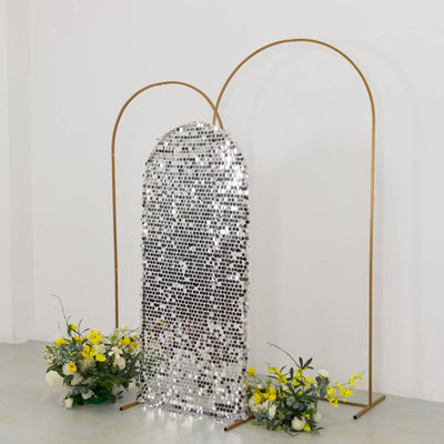 Mirror backdrop with gold frame and floral arrangements