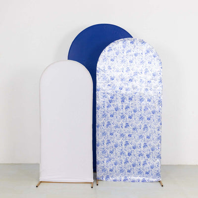 Three backdrop stands in white, blue, and floral pattern on a plain background.