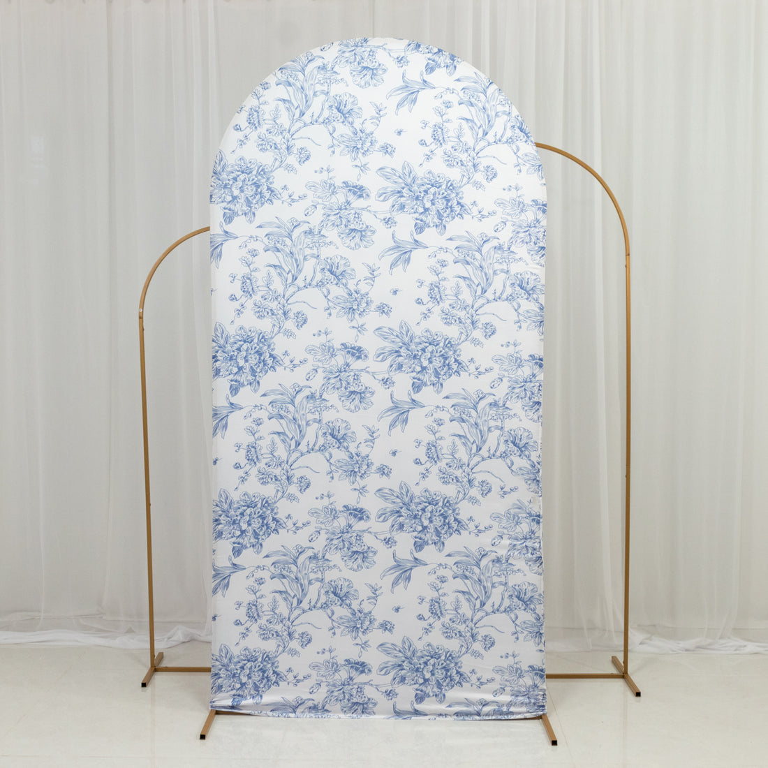 Decorative floral backdrop with blue and white pattern on a gold stand.