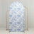 Decorative floral backdrop with blue and white pattern on a gold stand.