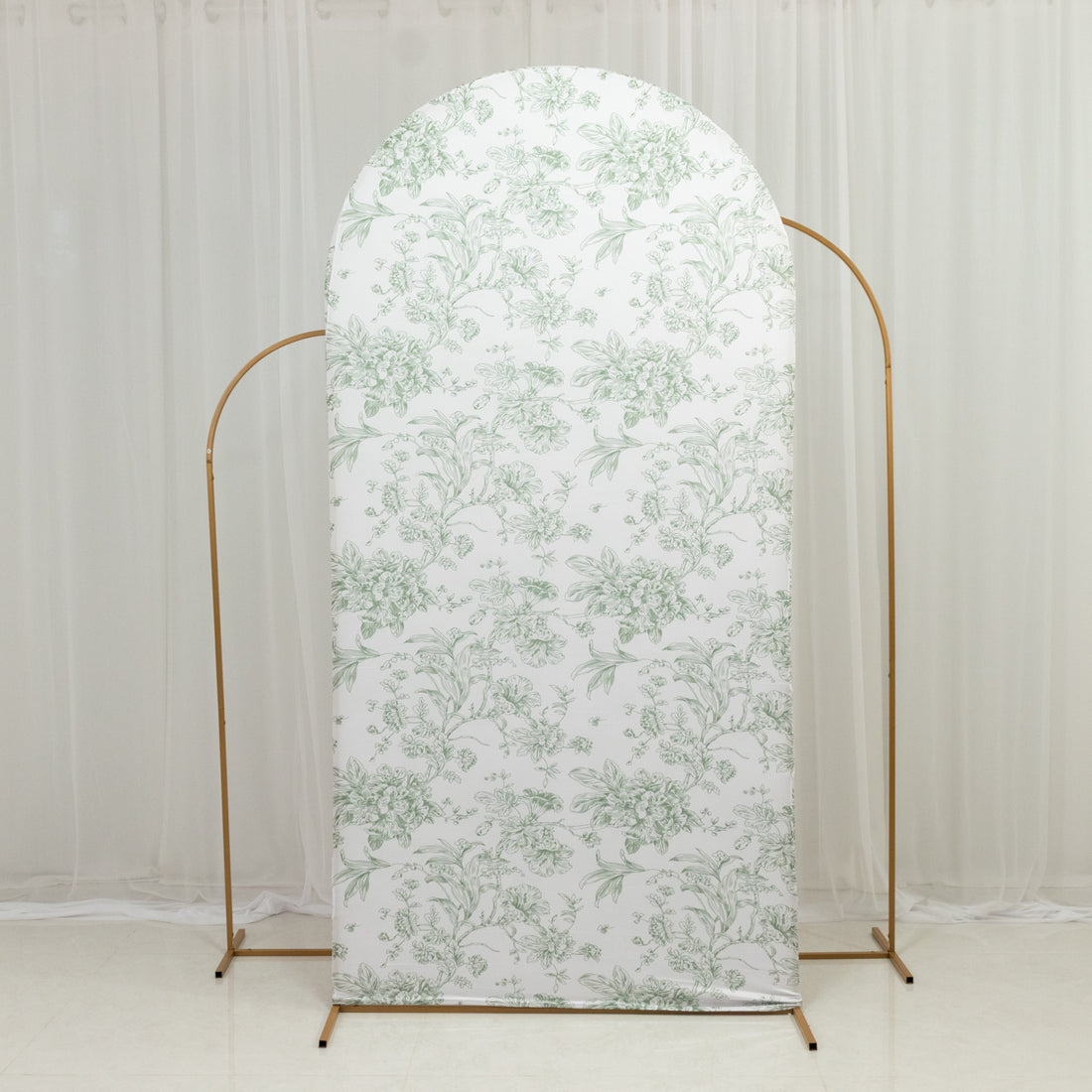 Floral patterned backdrop on a gold stand for photography.
