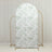 Floral patterned backdrop on a gold stand for photography.