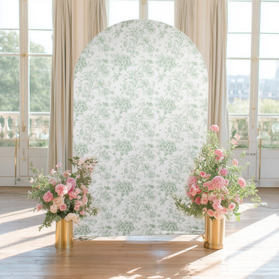 Floral backdrop with pink flower arrangements in gold vases.