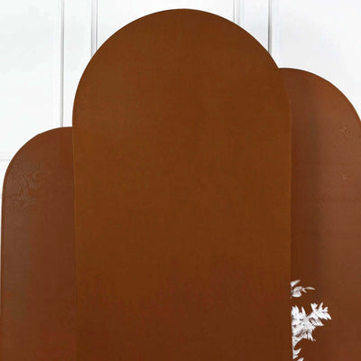 Brown decorative wall panels with rounded tops and white floral accents.
