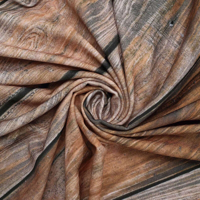 Textured fabric with swirls of brown and beige hues.