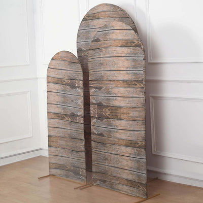 Wooden arch display stands in varying heights against a plain background.