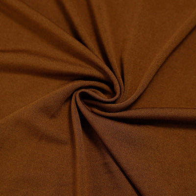 Brown fabric swirl texture close-up for design use.