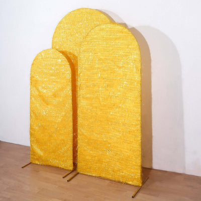 Three decorative yellow arches on a plain backdrop.