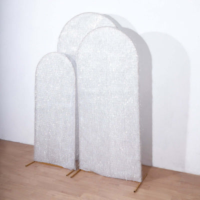 Three decorative, shimmering screens in varying heights on a plain background.