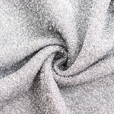 Shimmering silver fabric with intricate texture details.