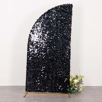 Black sequined backdrop with a curved top for event decoration.
