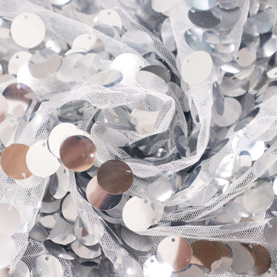 Silver sequin fabric on a white background