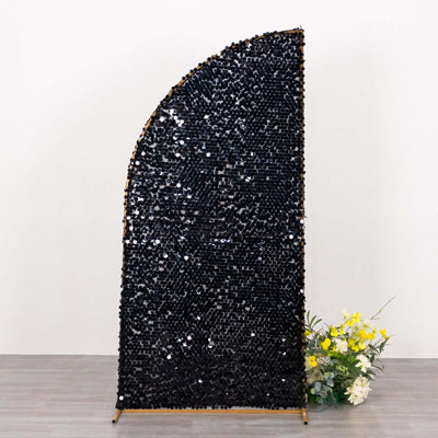 Decorative black sequin room divider with a curved design and floral arrangement.