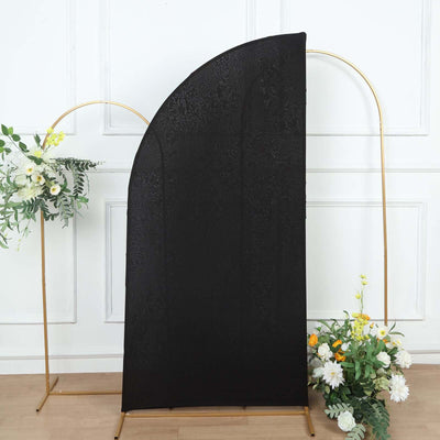 Black textured backdrop with floral design for photography setups.