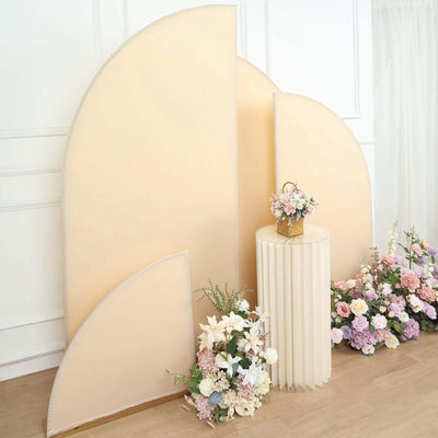 Floral arrangement with pastel backdrop and round table in a bright setting.