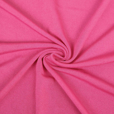 Close-up of soft pink fabric texture, showcasing its smoothness and flexibility.