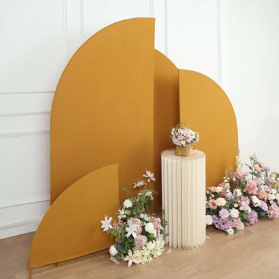 Decorative backdrop with yellow curves and floral arrangements in a studio setting.