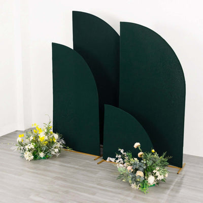 Decorative green curved panels with floral arrangements in front.