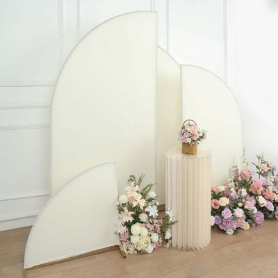 Elegant floral arrangement with decorative backdrop and table setting.