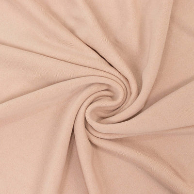Soft beige fabric with a smooth texture, elegantly twisted in a spiral.