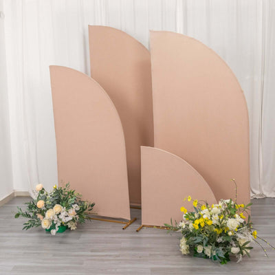 Decorative fabric backdrops with floral arrangements in a studio setting.