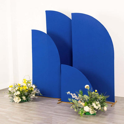 Blue curved backdrop panels with floral arrangements in front.