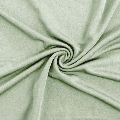 Soft green fabric swirling in a textured pattern.