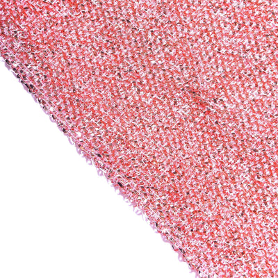 Textured pink fabric with a shiny finish, showcasing unique weave pattern.