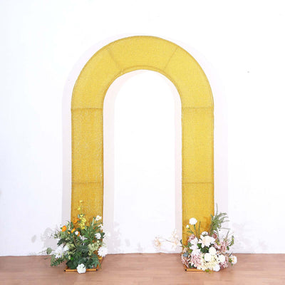 Yellow arch with floral arrangements at the base