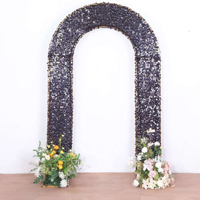 Decorative arch adorned with flowers and crystals, perfect for events or photo backdrops.