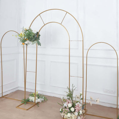 Gold metal arch with floral arrangements for events and decor.