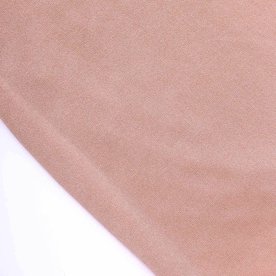 Close-up of smooth, light brown fabric texture.