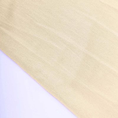 Close-up of soft, textured beige fabric.