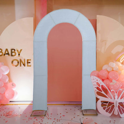 Archway decoration for baby-themed event with pastel colors and balloons.