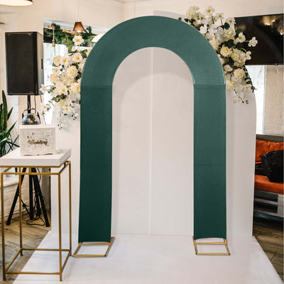 Green arch backdrop with floral arrangement for events
