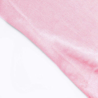 Pink fabric texture close-up showing soft sheen and smooth surface.