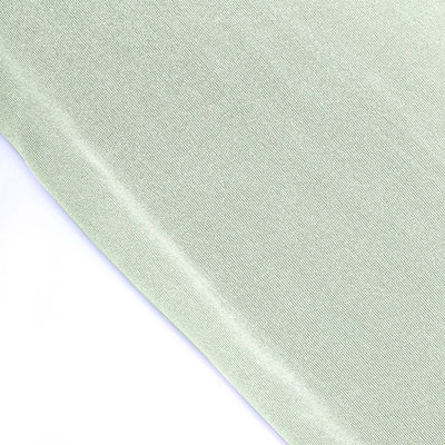 Light green fabric with a smooth texture and subtle sheen.