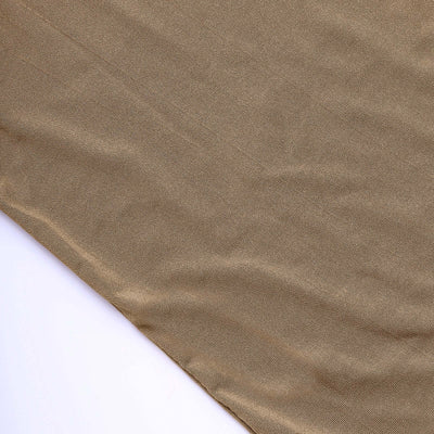 Beige textured fabric draped on a white background.