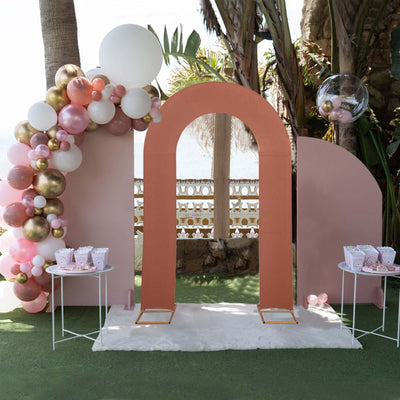 Colorful balloon arch and decor for a festive outdoor event setting.