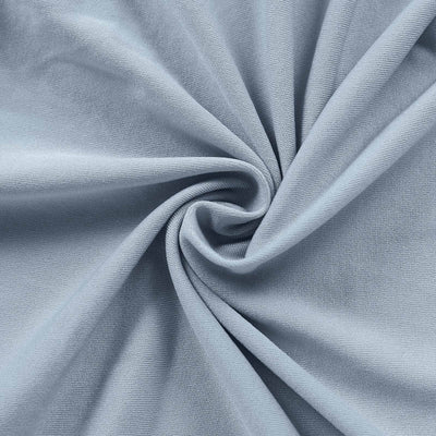 Light blue fabric texture with a smooth, swirling pattern.