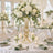 Elegant white and green wedding reception table with floral centerpiece and candles