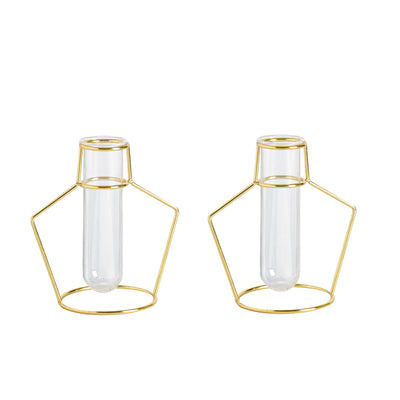 Gold wire vase holders with glass test tubes, modern decor accents.