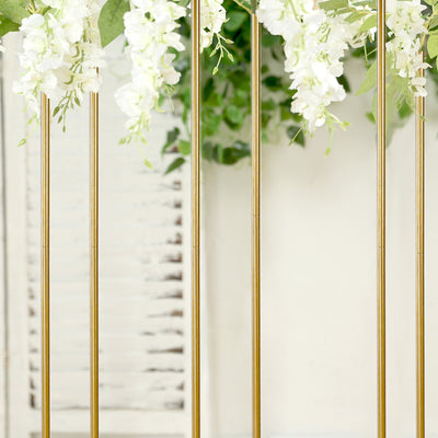 Gold flower stand with white blooms and greenery